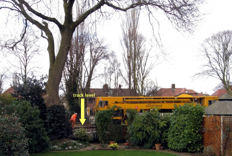 3_feb_2014_compacting_ballast_and_raising_track_behind_40_holkham_ave_showing_track_level.jpg